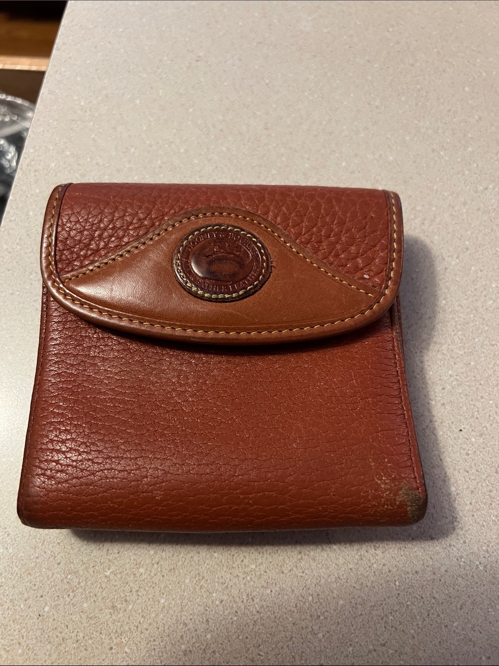 Dooney & Bourke Chestnut Brown All Weather Leather Compact Wallet
